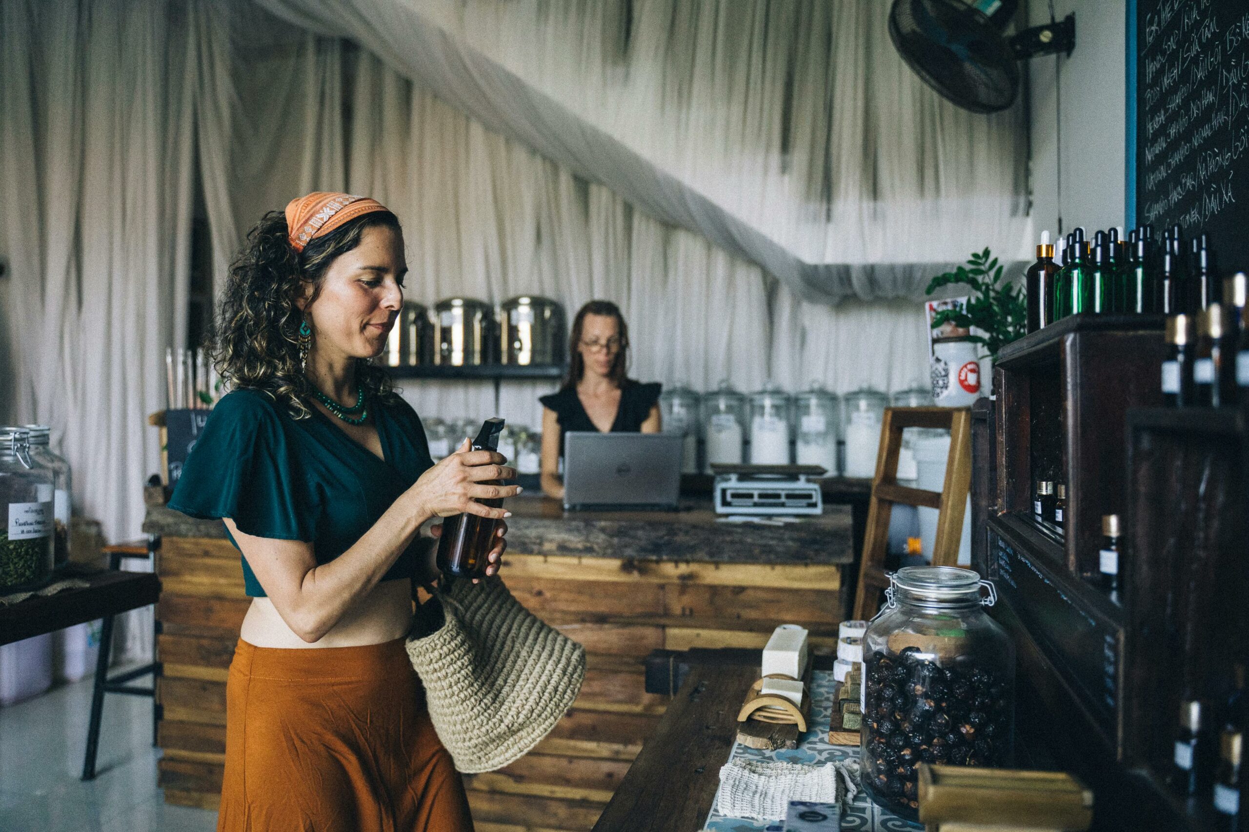 Plastic-free essentials: a woman explores a shop specialising in plastic free products and refillable containers