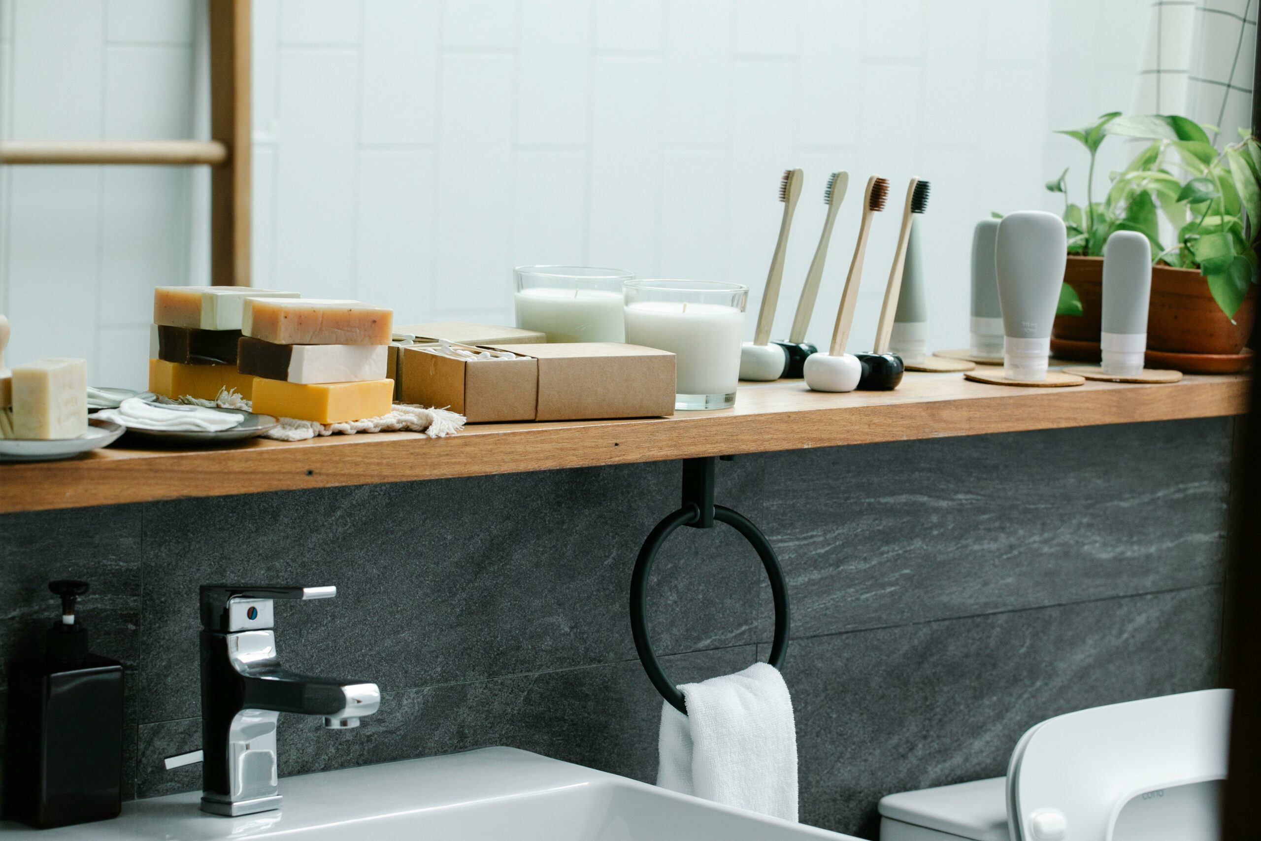 Plastic-free bathroom with bamboo toothbrush, soap bars and refillable bottles